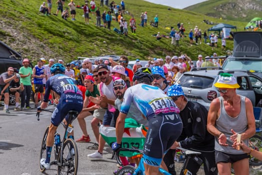 Col du Tourmalet, France - July 06 2023: Gorka Izagirre and Romain Bardet climbig the road to Col du Tourmalet in Pyerenees mountains during the stage 6 of Le Tour de France 2023.