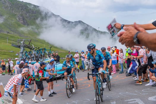 Col du Tourmalet, France - July 06 2023: Team Astana climbig the road to Col du Tourmalet in Pyerenees mountains during the stage 6 of Le Tour de France 2023.