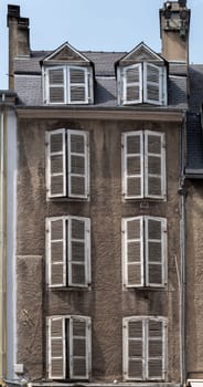 old shutter on the facade of an old building