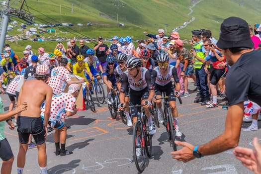 Col du Tourmalet, France - July 06 2023: Emirates Team climbig the road to Col du Tourmalet in Pyerenees mountains during the stage 6 of Le Tour de France 2023.