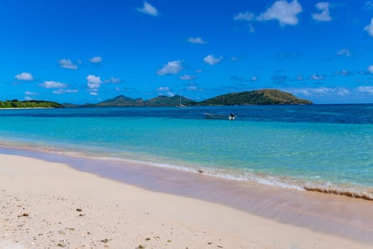 Nacula, Fiji: 26 May 2023: Tourist boats at the tropical sandy beach of Nacula island, Yasawa islands, Fiji, South Pacific Islands, Pacific