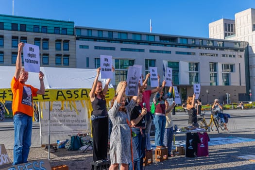 Berlin, Germany - 11 August 2023: Protesters with banners in support of a renowned activist and founder of WikiLeaks non profit organisation Julian Assange in the streets of Berlin