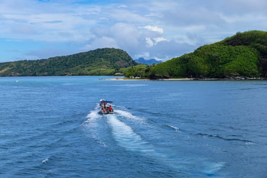 Nacula Fiji: June 25 2023: Group of tourists on a ship in the coast Nacula island, Yasawa islands, Fiji, South Pacific Islands, Pacific