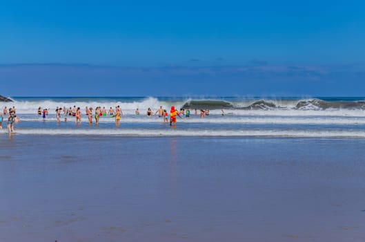 Biarritz, France, July 03, 2023: People at the beach Grande Plage (Big beach) in the French resort town of Biarritz.