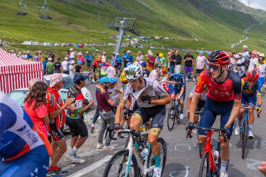 Col du Tourmalet, France - July 06 2023: Riders climbig the road to Col du Tourmalet in Pyerenees mountains during the stage 6 of Le Tour de France 2023.