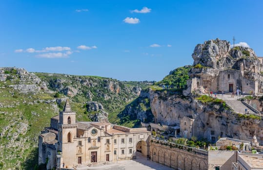 Matera, Italy - 6 May 2023: Old town of Matera (Sassi di Matera), Basilicata, southern Italy. Prehistoric cave dwellings