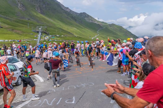 Col du Tourmalet, France - July 06 2023: Riders climbig the road to Col du Tourmalet in Pyerenees mountains during the stage 6 of Le Tour de France 2023.