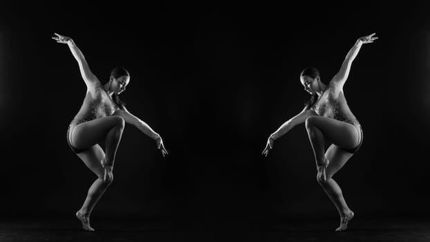 Beautiful ballet dancer sport aerobics female posing on a white and black studio background