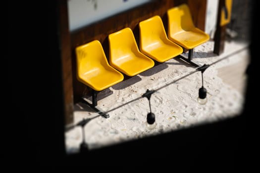 Yellow plastic seats on the road, stock photo