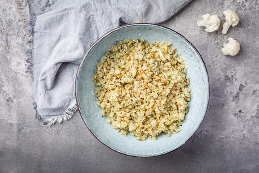 Roasted  organic cauliflower rice with herbs - paleo and ketogenic diet concept