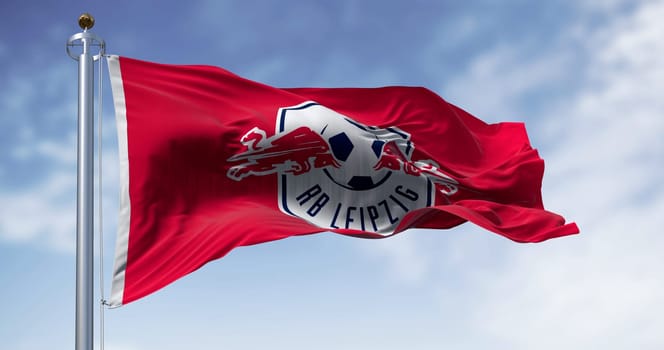 Leipzig, DE, Nov. 2 2023: RB Leipzig flag waving on a clear day. German professional sports club based in Leipzig. Illustrative editorial 3d illustration render. Waving flag
