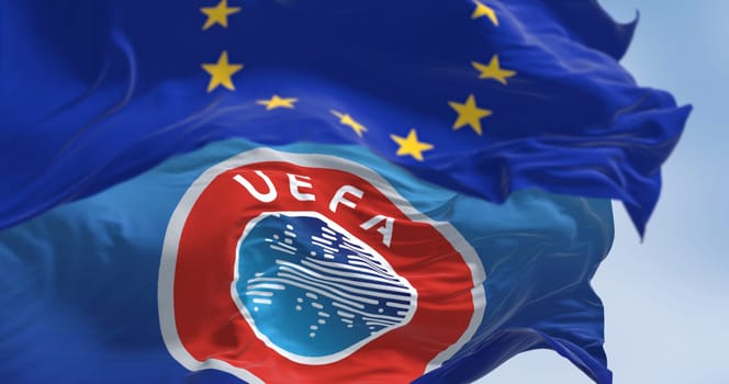 Luxemburg City, LU, Dec 21 2023: Close-up of European Union and UEFA flags waving in the wind. On Dec 2023 European Court of Justice Declares UEFA, FIFA Block of European Super League Unlawful