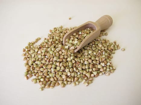 Hulled buckwheat grains on a wooden board