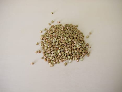 Hulled buckwheat grains on a wooden board
