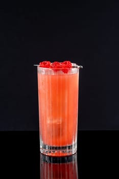 Prince of Wales Punch cocktail garnished with raspberries