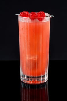 Prince of Wales Punch cocktail garnished with raspberries