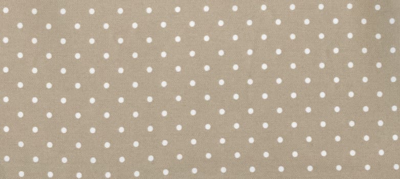 light brown beige polka dot texture useful as a background