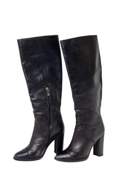 A pair of black elegant female boots or woman shoes isolated on a white background. Leather boots. Clipping path.