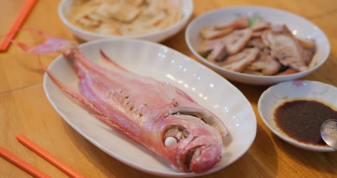 Hong Kong style home cuisine, family dinner concept, steamed fish, fry vegetable and meat