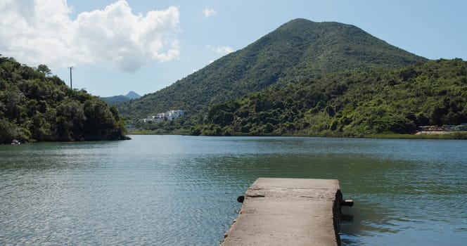 Mountain and sea with pier