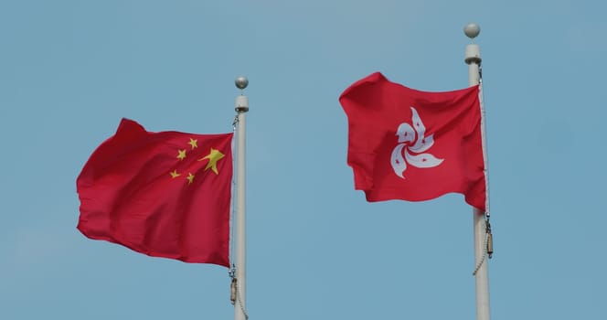 Flag of China and Hong Kong Waving with blue sky
