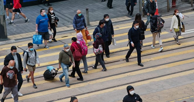 Central, Hong Kong 15 December 2020: Top view of the people cross the road