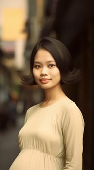 Pregnant Asian woman concept. Maternity photography. Beautiful natural woman holding her pregnant belly happy portrait
