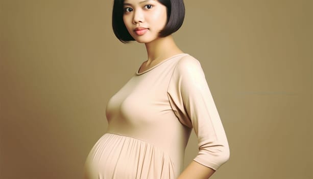 Pregnant Asian woman concept. Maternity photography. Beautiful natural woman holding her pregnant belly happy portrait