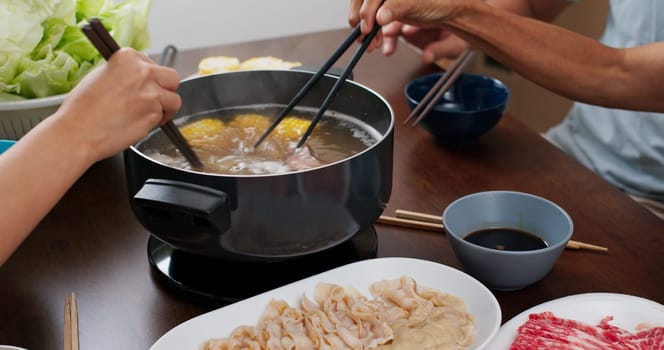 Chinese hot pot with family at home