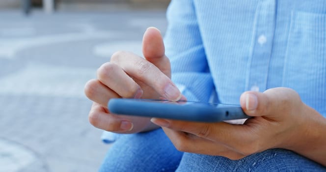 Close up of woman use of mobile phone at outdoor