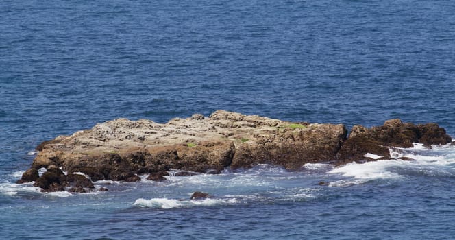 Skerry small rocky island over the sea