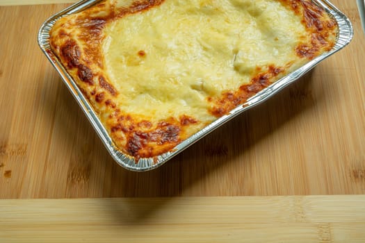 Lasagna from the supermarket baked in the oven, top view