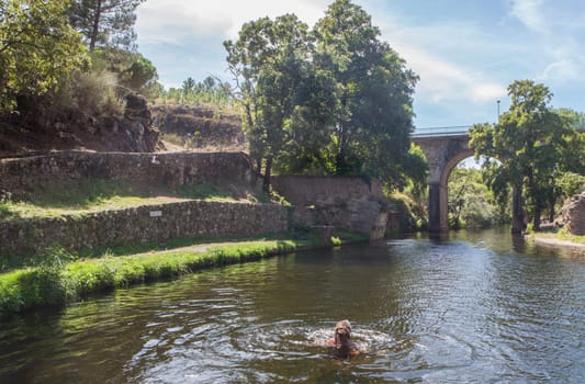 Perales del Puerto natural swimming pool. Crystal-clear waters spot in the heart of Sierra de Gata, Caceres, Extremadura, Spain