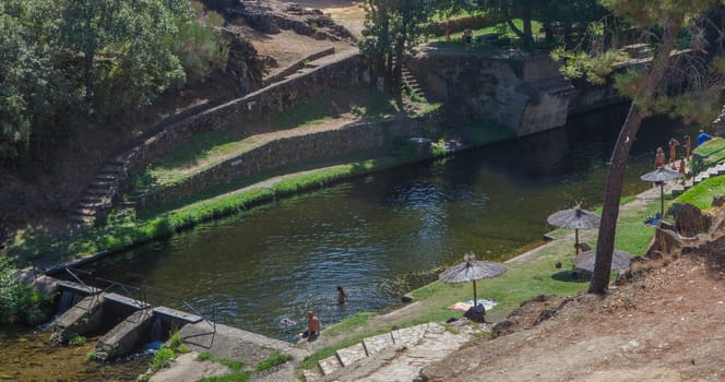 Perales del Puerto natural swimming pool. Crystal-clear waters spot in the heart of Sierra de Gata, Caceres, Extremadura, Spain