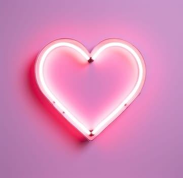 a heart neon sign is lighted up on a pink background.