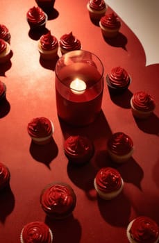 cupcakes in red velvet heart shape on table.
