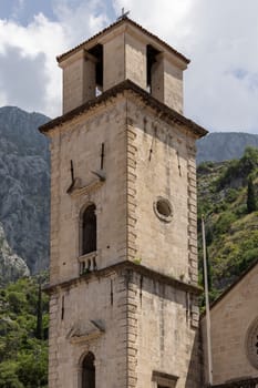 Kotor, Montenegro - June 26, 2023: Tower of Cathedral of Saint Tryphon (Kotor Cathedral), roman catholic medieval church
