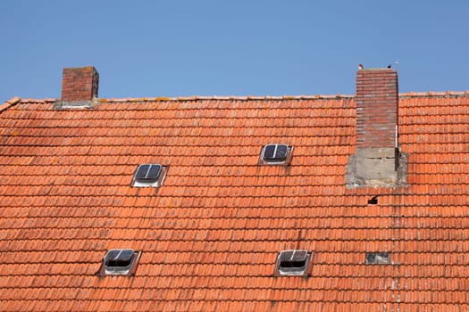 Roof, chimney, skylights, reddish bricks, Germany