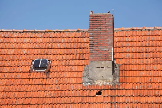 Roof, chimney, skylights, reddish bricks, Germany