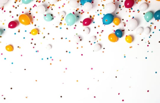 colorful multi color confetti balloons floating over white background.