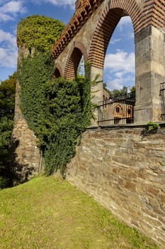 Kamieniec Zabkowicki, Poland - October 2, 2021: Kamieniec Zabkowicki Palace, 19th-century palace located in a village in the Lower Silesian Voivodeship. Fragment of the wall surrounding the building