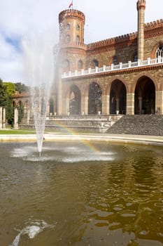 Kamieniec Zabkowicki, Poland - October 2, 2021: Kamieniec Zabkowicki Palace, 19th-century monumental palace located in a village in the Lower Silesian Voivodeship. Fountain in front of the main entrance