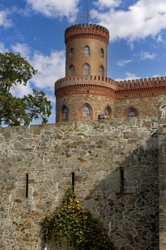 Kamieniec Zabkowicki, Poland - October 2, 2021: Kamieniec Zabkowicki Palace, 19th-century palace located in a village in the Lower Silesian Voivodeship. Fragment of the wall surrounding the building