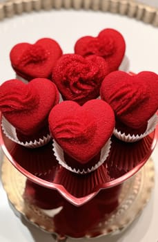 heart shaped bowls of red icing.