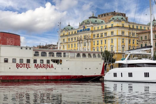 Rijeka, Croatia - September 23, 2023: Port of Rijeka with Adria Palace, decorative building seat of Jadrolinija, the ferry operator