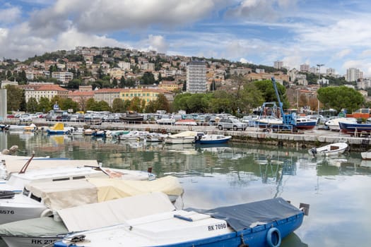 Rijeka, Croatia - September 23, 2023: View of Mrtvi Kanal, old riverbed of Rjecine. Embankment and moored boats in the marina