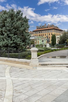 Rijeka, Croatia - September 23, 2023: Classicist-art nouveau style Theatre Park with statue of Ivan Zajc, Croatian composer. Great Market Hall in the distance