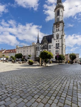 Zabkowice Slaskie, Poland - October 2, 2021: Market square with neo-gothic 19th century Town Hall, Lower Silesian Voivodeship