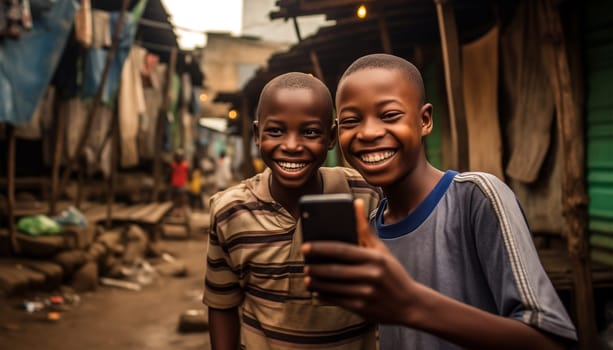 Two boys taking a selfie.African kids using mobile phones. two african boys sitting outside using smartphones to play games portrait
