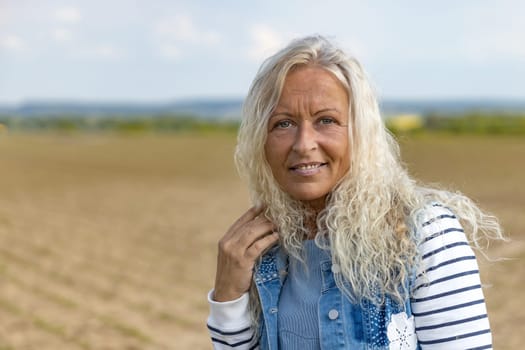 Portrait from happy caucasian woman with long hair